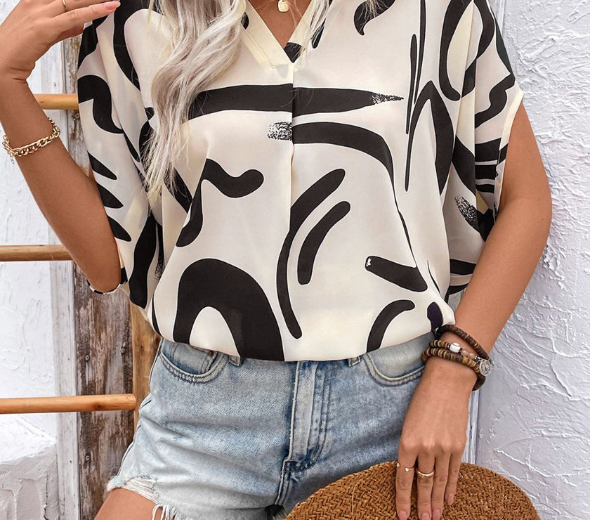 Perfee Printed Notched Half Sleeve Blouse