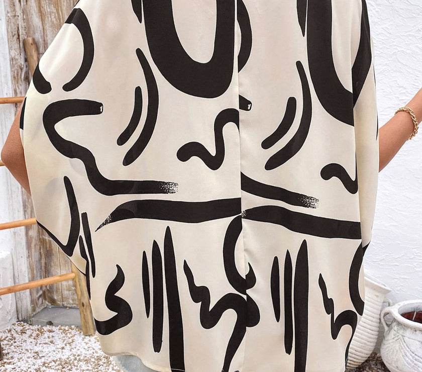 Perfee Printed Notched Half Sleeve Blouse