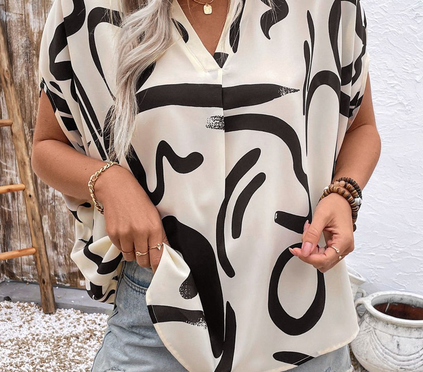 Perfee Printed Notched Half Sleeve Blouse